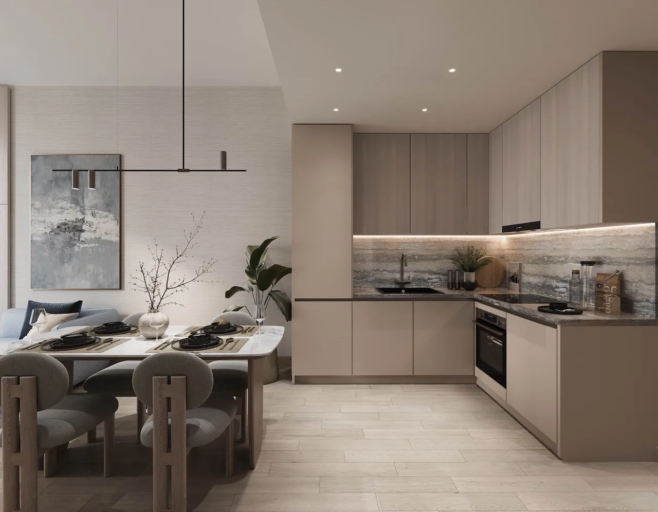 Modern apartment kitchen and dining area at Inara Residence in Dubai featuring minimalist cabinetry, integrated appliances, elegant dining setup, and contemporary interior design, presented by Tohid Fetrat