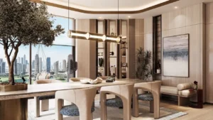 Luxury clubhouse dining and lounge interior at Inara Residence in Dubai featuring designer dining furniture, warm lighting, curated décor, and panoramic skyline views, presented by Tohid Fetrat