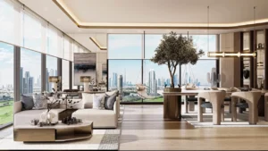 Panoramic clubhouse lounge and dining interior at Inara Residence in Dubai featuring open-plan layout, designer sofas, sculptural dining table, natural wood finishes, warm lighting, and full-height skyline views, presented by Tohid Fetrat