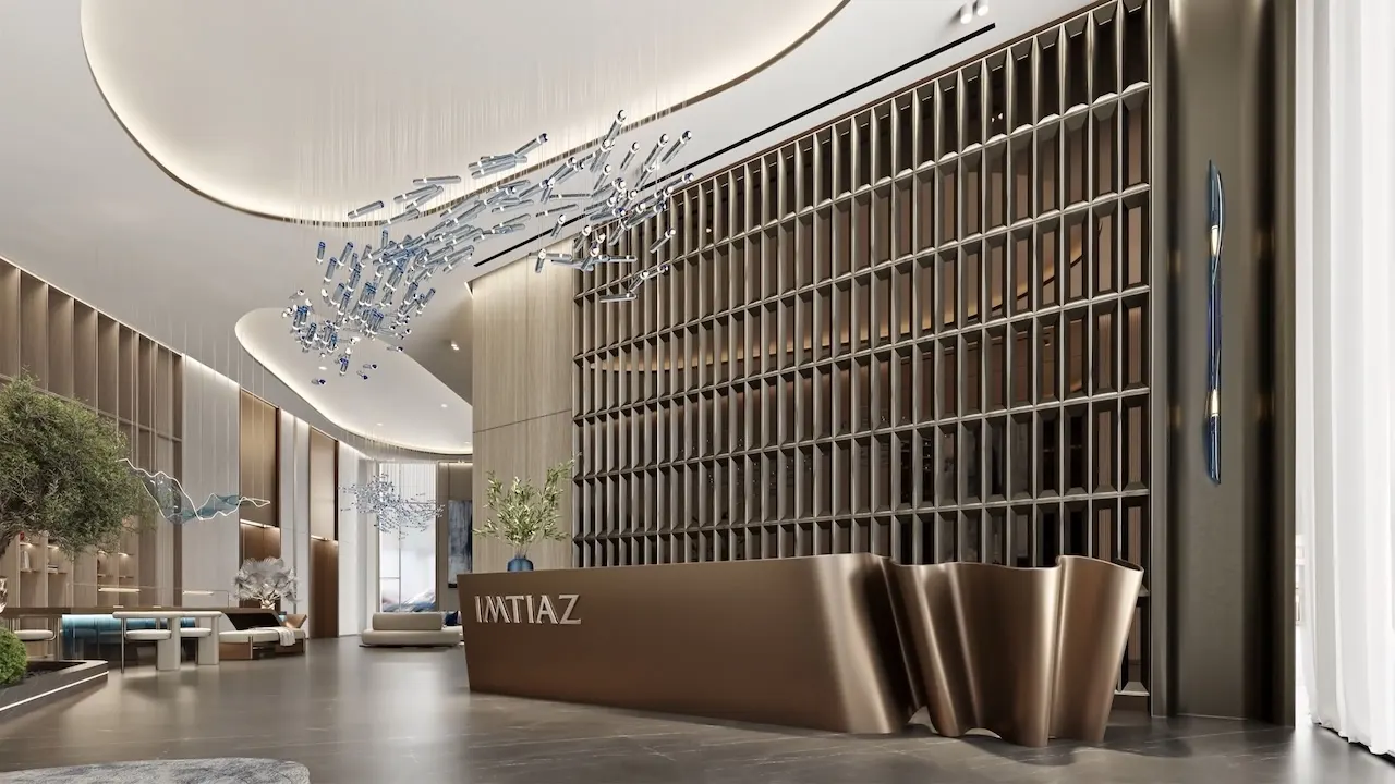 Luxury lobby reception at Inara Residence in Dubai featuring a sculptural Imtiaz reception desk, artistic chandelier lighting, refined wall detailing, and a grand contemporary arrival space, presented by Tohid Fetrat