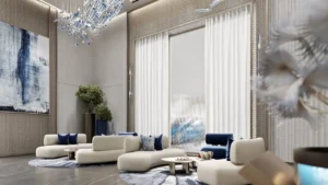 Elegant lobby seating area at Inara Residence in Dubai featuring sculptural lounge sofas, artistic chandelier lighting, refined wall textures, and a calm contemporary reception atmosphere, presented by Tohid Fetrat