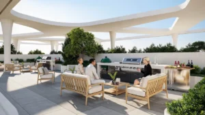 Rooftop BBQ and outdoor kitchen lounge at Inara Residence in Dubai featuring modern grilling stations, premium seating, shaded architectural canopies, landscaped greenery, and a refined social setting, presented by Tohid Fetrat