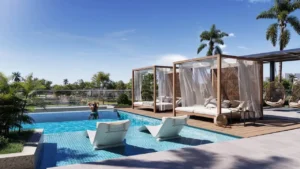 Rooftop swimming pool with private cabanas at Inara Residence in Dubai featuring sun loungers, shaded daybeds, landscaped greenery, and a resort-style relaxation environment, presented by Tohid Fetrat