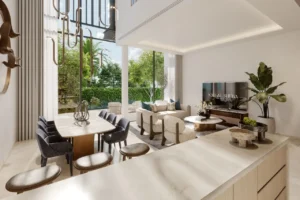 Dining area interior of a three bedroom townhouse at Nad Al Sheba Gardens Phase 11 with modern table setting, open plan layout and garden view Presented by Tohid Fetrat
