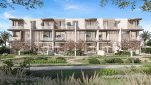 Three bedroom townhouses with garden terraces at Nad Al Sheba Gardens Phase 11 featuring landscaped courtyards and modern facade design Presented by Tohid Fetrat