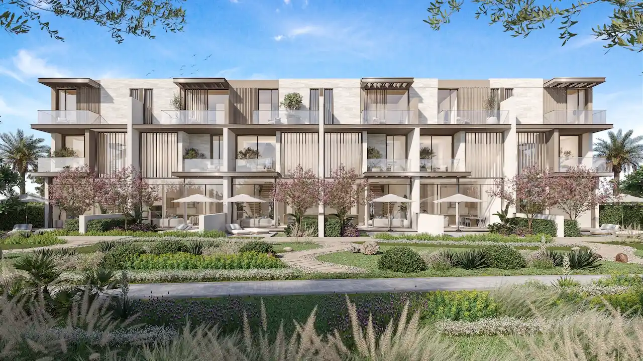 Three bedroom townhouses with garden terraces at Nad Al Sheba Gardens Phase 11 featuring landscaped courtyards and modern facade design Presented by Tohid Fetrat