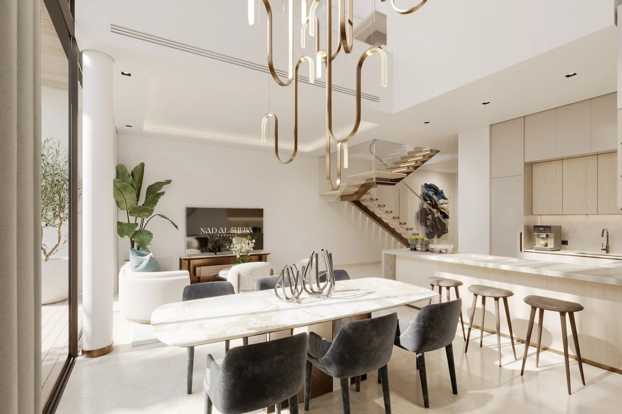 Open plan living interior of a three bedroom townhouse at Nad Al Sheba Gardens Phase 11 with contemporary seating, natural daylight and refined finishes Presented by Tohid Fetrat
