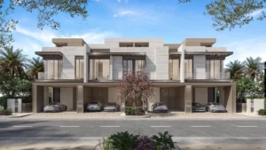 Three bedroom townhouse street facade at Nad Al Sheba Gardens Phase 11 with private covered parking and contemporary exterior design Presented by Tohid Fetrat
