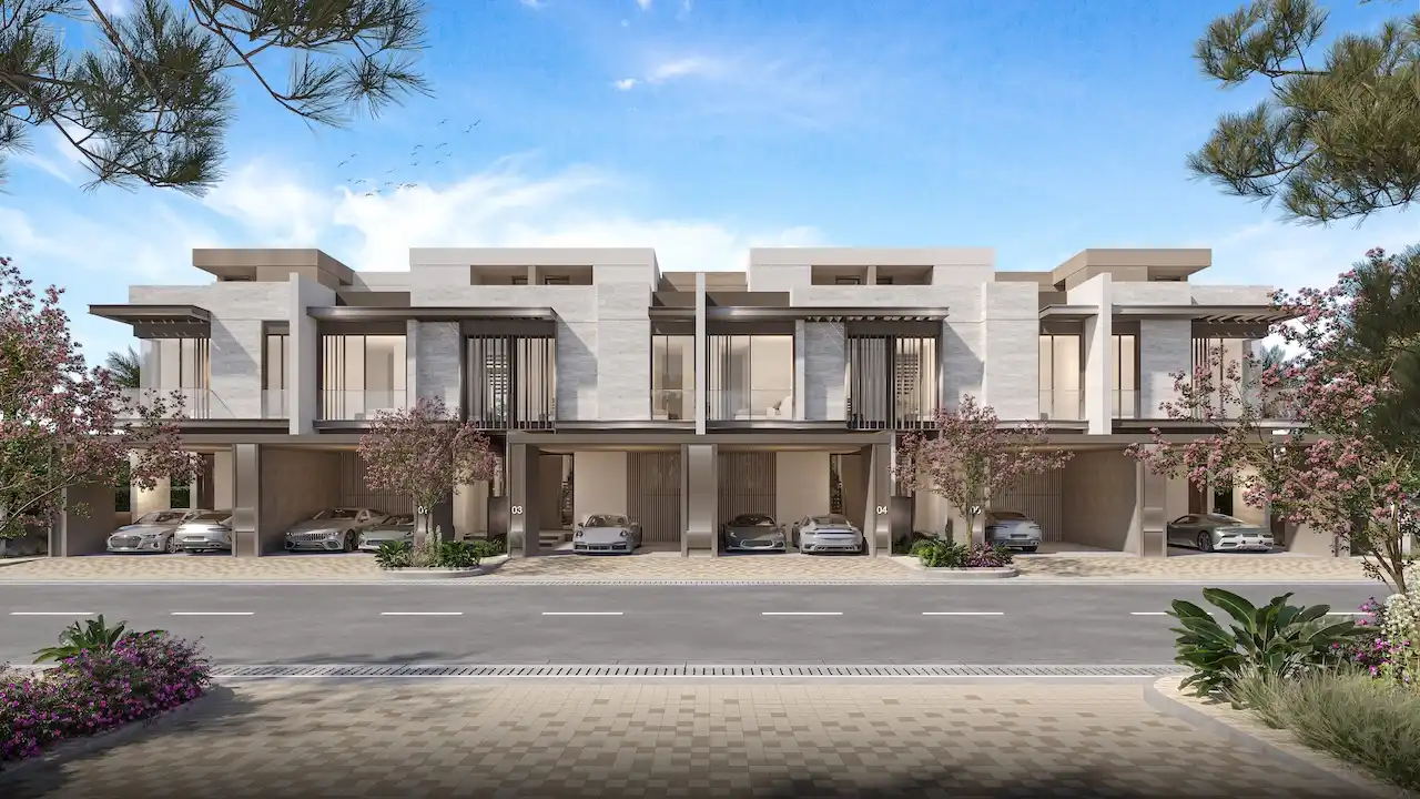 Three bedroom townhouses street view at Nad Al Sheba Gardens Phase 11 with private carports, modern facade and landscaped frontage Presented by Tohid Fetrat