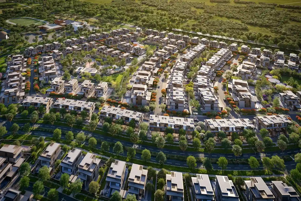 Aerial view of Nad Al Sheba Gardens Phase 11 showing modern villas, landscaped green spaces, internal roads, and family oriented amenities in Nad Al Sheba Dubai Presented by Tohid Fetrat