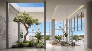 Palm Central Frond M Residences double height lobby with indoor garden courtyard and panoramic waterfront views at Palm Jebel Ali Dubai - Presented by Tohid Fetrat