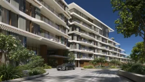 Palm Central Frond M Residences modern building exterior and arrival entrance surrounded by landscaped gardens at Palm Jebel Ali Dubai - Presented by Tohid Fetrat