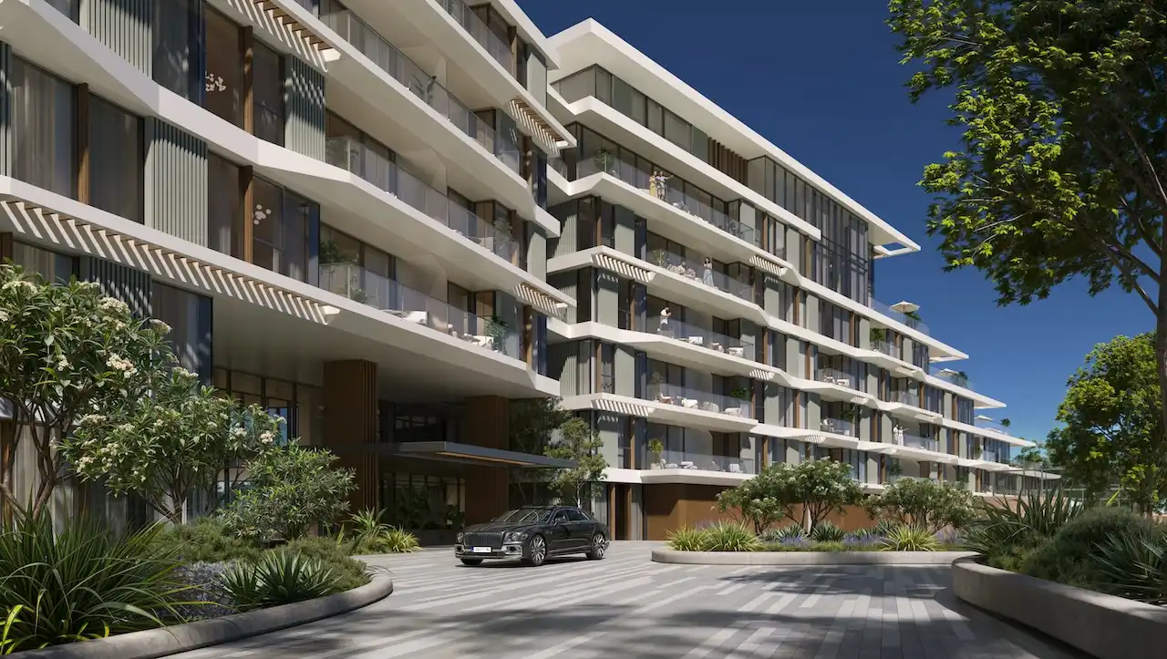 Palm Central Frond M Residences modern building exterior and arrival entrance surrounded by landscaped gardens at Palm Jebel Ali Dubai - Presented by Tohid Fetrat