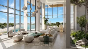 Palm Central Frond M Residences waterfront lobby lounge with panoramic sea views and double height glazing at Palm Jebel Ali Dubai - Presented by Tohid Fetrat