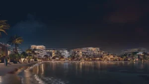 Palm Central Frond M Residences at Palm Jebel Ali waterfront buildings illuminated at night overlooking lagoon Dubai - Presented by Tohid Fetrat