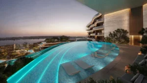 Adults infinity pool at The Meriva Collection by Ellington overlooking waterfront skyline with contemporary terrace design in Dubai Presented by Tohid Fetrat