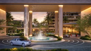 Entrance drop off area of The Meriva Collection by Ellington with water fountain, illuminated columns and landscaped arrival plaza in Dubai Presented by Tohid Fetrat