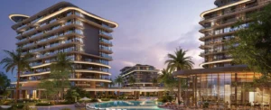 Evening view of The Meriva Collection by Ellington with illuminated facades, resort pool and landscaped surroundings in Dubai Presented by Tohid Fetrat