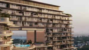 Facade detail of The Meriva Collection by Ellington displaying layered balconies, glass railings and elevated pool deck in Dubai Presented by Tohid Fetrat