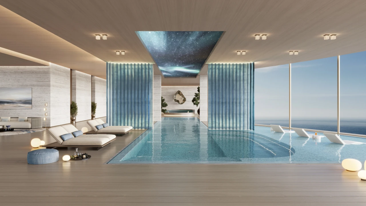 Indoor infinity pool at The Meriva Collection by Ellington with sea view, relaxation loungers and luxury wellness design in Dubai Presented by Tohid Fetrat