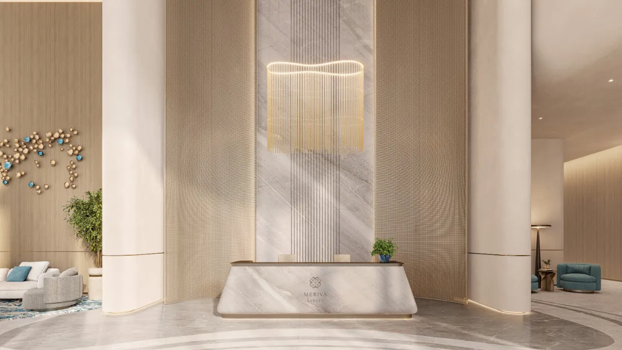 Reception area at The Meriva Collection by Ellington featuring marble desk, artistic lighting and luxury lobby design in Dubai Presented by Tohid Fetrat