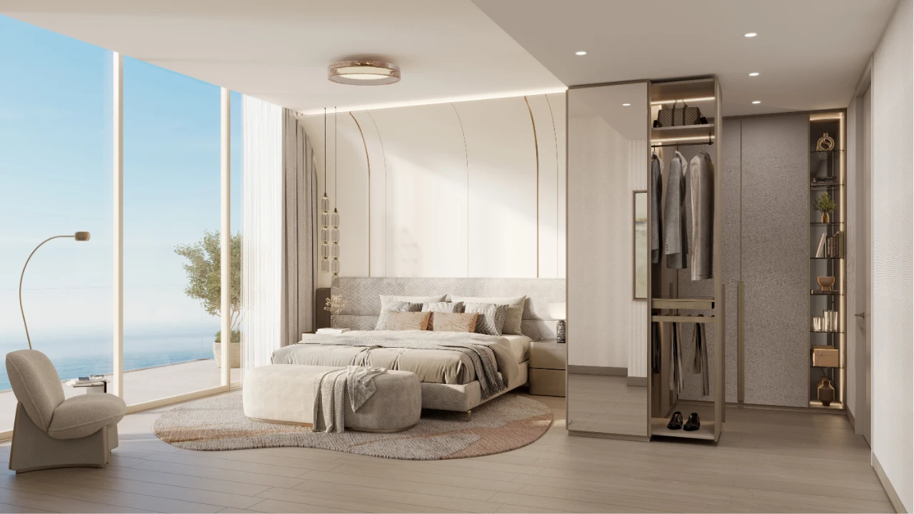 Master bedroom at The Meriva Collection by Ellington with sea view, walk in wardrobe and contemporary interior design in Dubai Presented by Tohid Fetrat