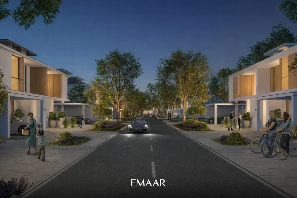 Evening street view of modern villas in The Valley by Emaar community showcasing contemporary architecture landscaped sidewalks and a family friendly residential environment in Dubai Presented by Tohid Fetrat
