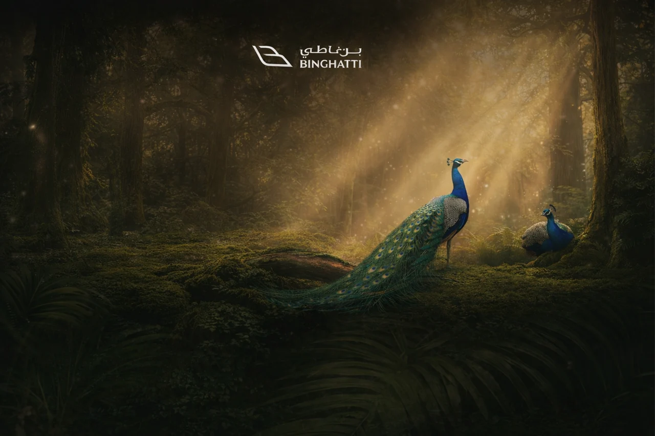 Artistic nature concept for Tilal Binghatti showing peacock in a golden forest atmosphere representing the spirit of Binghatti first villas and townhouses community Presented by Tohid Fetrat