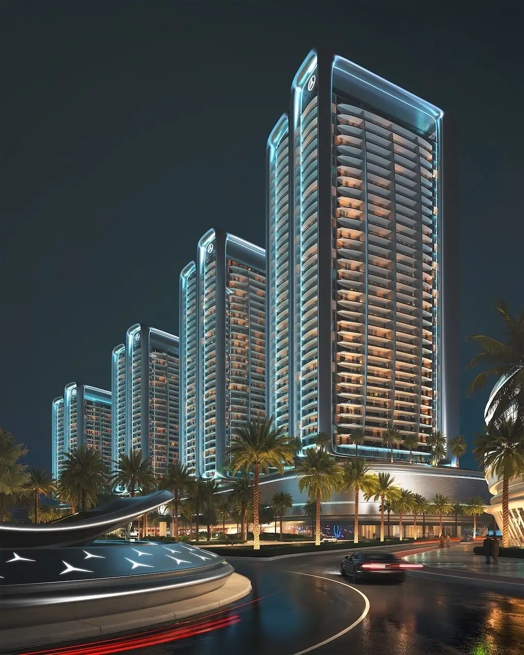 Night street level view of Vision Iconic at Mercedes Benz Places Binghatti City featuring illuminated residential towers palm lined boulevard and modern architectural facade in Dubai Presented by Tohid Fetrat