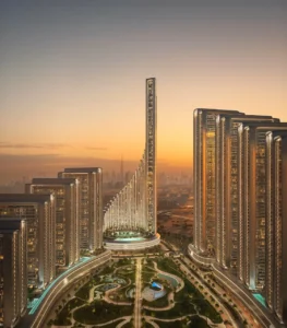 Sunset view of Vision Iconic at Mercedes Benz Places Binghatti City featuring central landmark tower landscaped gardens and illuminated residential buildings in Dubai Presented by Tohid Fetrat