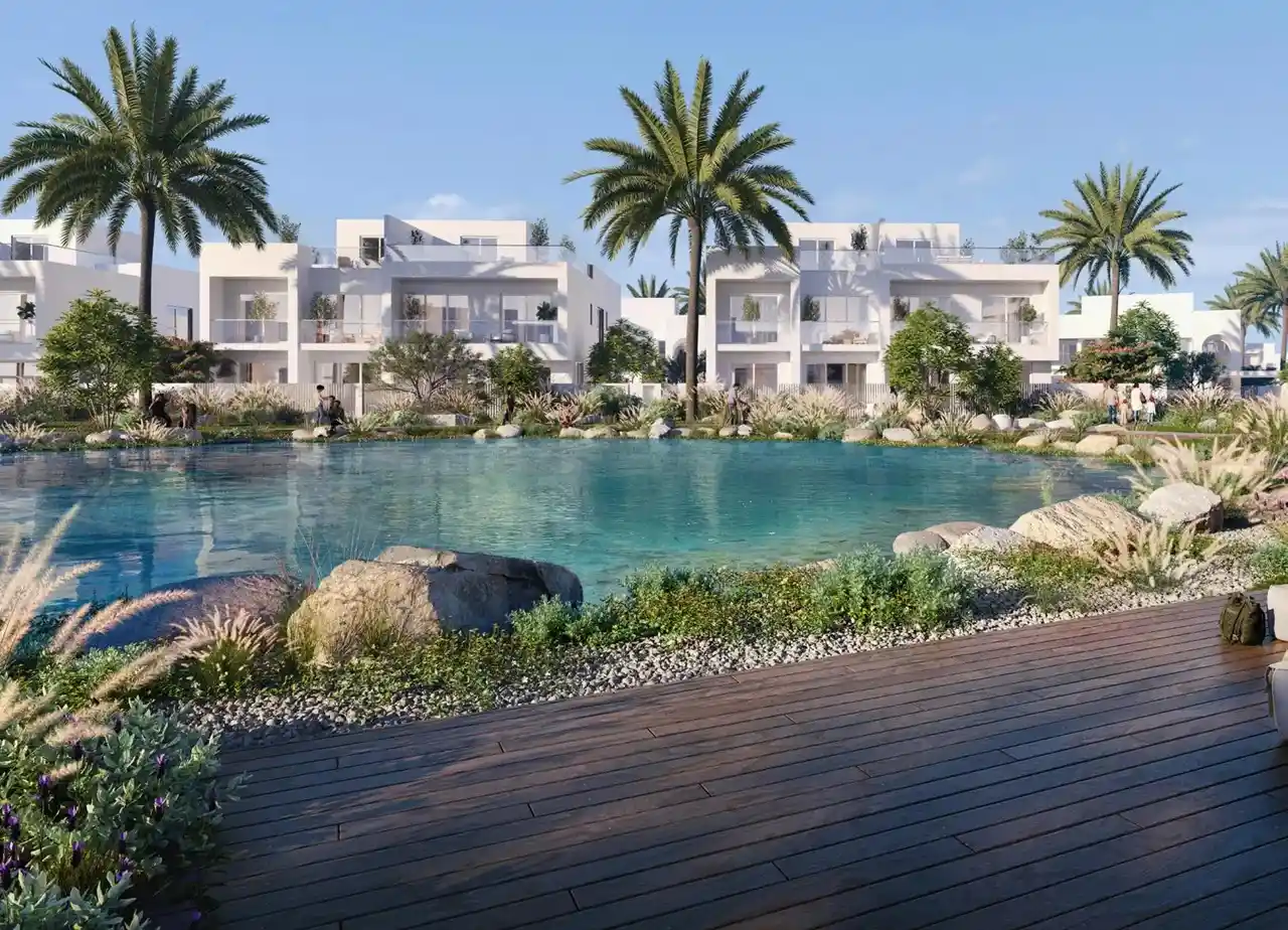 Alana at The Valley by Emaar lagoon view with modern villas palm trees and landscaped waterfront in Dubai - Presented by Tohid Fetrat