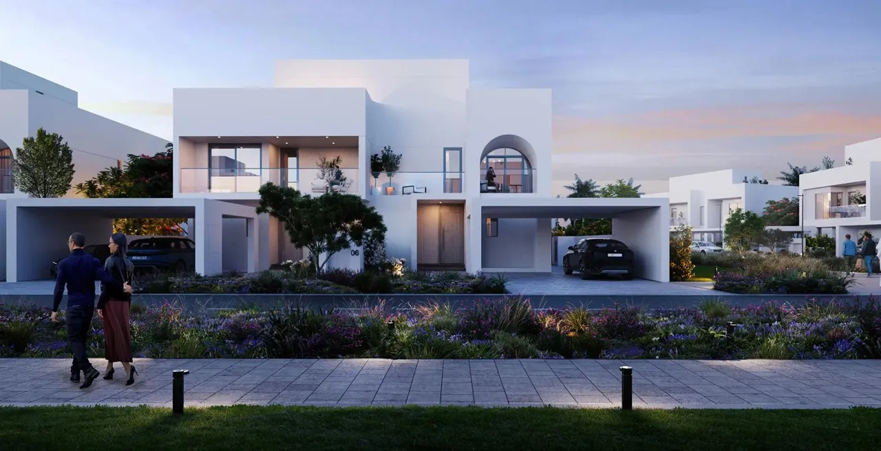 Alana at The Valley by Emaar modern villa exterior at evening with soft lighting landscaped garden and covered parking in Dubai - Presented by Tohid Fetrat