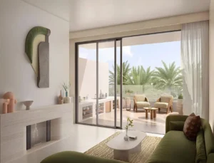 Alana at The Valley by Emaar living area with sliding glass doors opening to a private terrace with outdoor seating in Dubai - Presented by Tohid Fetrat