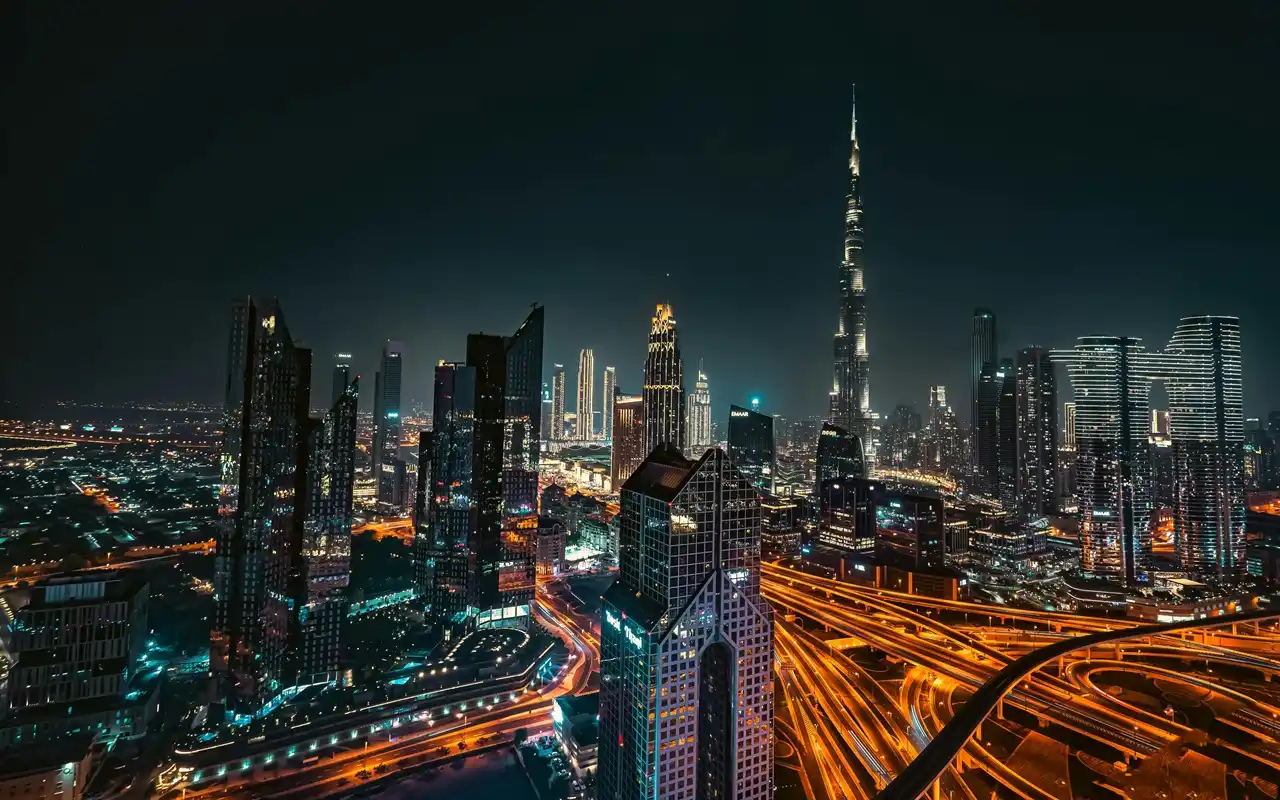 Downtown Dubai skyline with Burj Khalifa at night representing opportunities to choose the right property in Dubai Presented by Tohid Fetrat