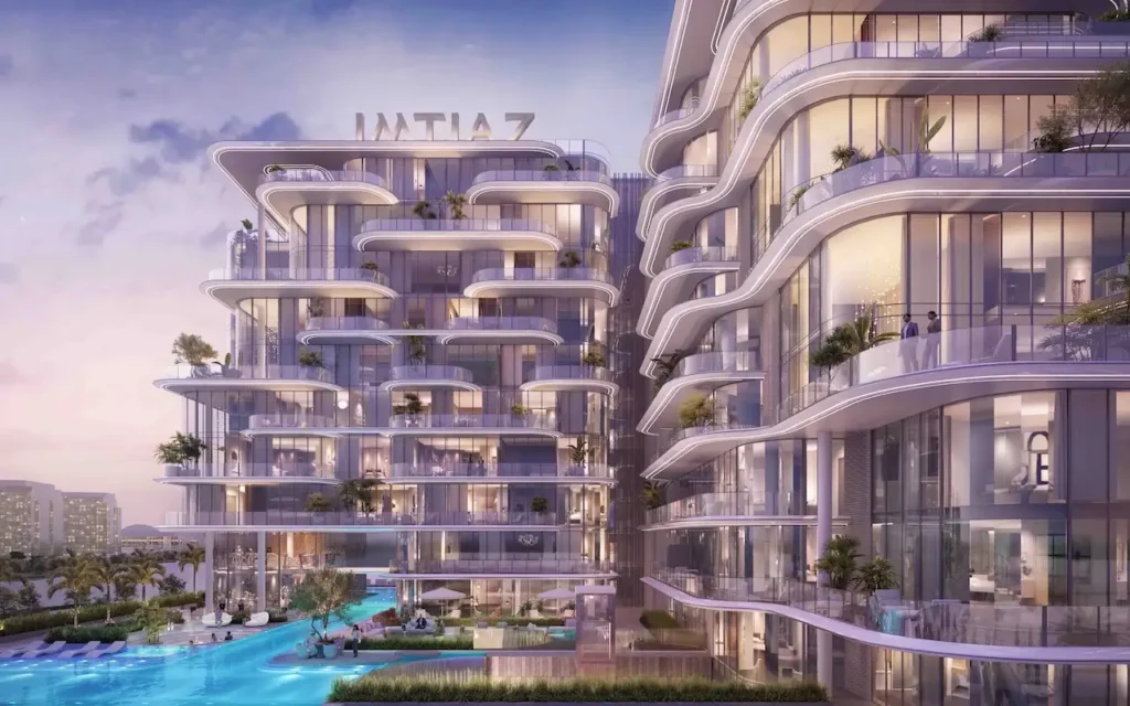 Cotier House 2 at Dubai Islands by Imtiaz luxury apartment evening facade with illuminated balconies and resort style pool courtyard in Dubai Presented by Tohid Fetrat