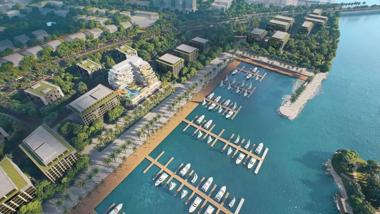 Cotier House at Dubai Islands by Imtiaz aerial view of luxury waterfront apartment development with marina promenade and yacht berths in Dubai Presented by Tohid Fetrat