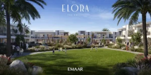 Elora at The Valley by Emaar landscaped community park with green lawns walking paths and modern townhouses surrounding outdoor family spaces in Dubai - Presented by Tohid Fetrat