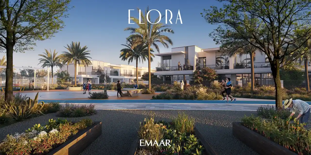Elora at The Valley by Emaar community sports court surrounded by landscaped gardens palm trees and modern townhouses in Dubai - Presented by Tohid Fetrat