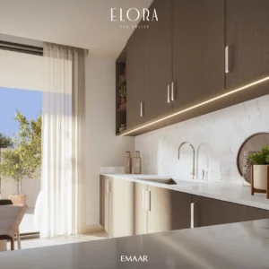 Elora at The Valley by Emaar modern kitchen interior with marble backsplash contemporary cabinetry and natural daylight in Dubai - Presented by Tohid Fetrat