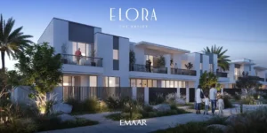 Elora at The Valley by Emaar modern townhouses with illuminated garden walkways landscaped greenery and evening residential atmosphere in Dubai - Presented by Tohid Fetrat