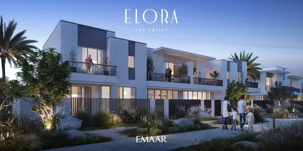 Elora at The Valley by Emaar modern townhouses with illuminated garden walkways landscaped greenery and evening residential atmosphere in Dubai - Presented by Tohid Fetrat