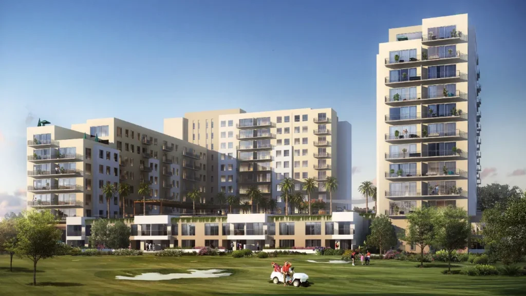 Modern mid rise apartment buildings overlooking a landscaped golf course with spacious balconies and palm lined podium at Emaar South Dubai Presented by Tohid Fetrat