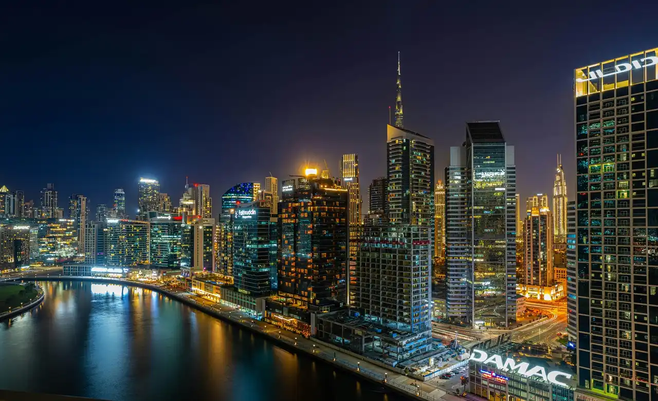 What mortgage property insurance does not cover in Dubai with night skyline view highlighting urban property risks and exclusions Presented by Tohid Fetrat