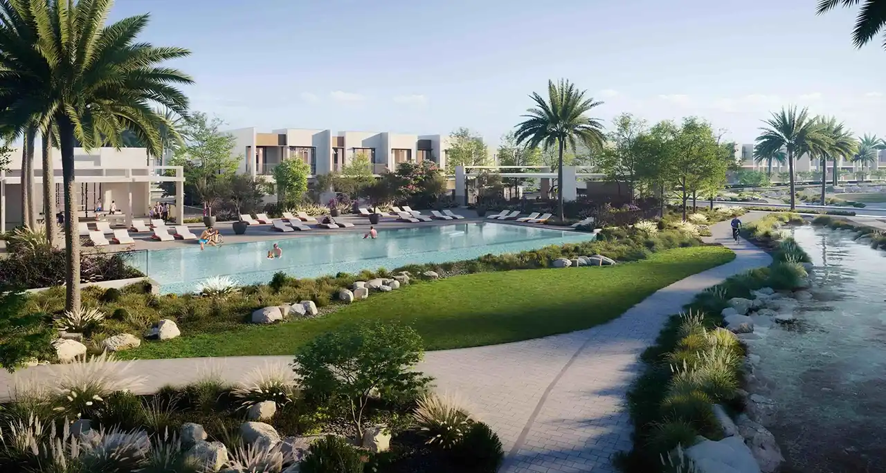 Nima at The Valley by Emaar community pool surrounded by landscaped gardens and modern villas in Dubai - Presented by Tohid Fetrat