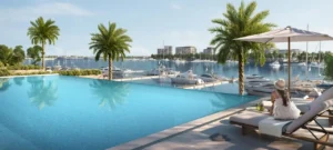 Porto View at Rashid Yachts & Marina by Emaar infinity pool overlooking marina with yachts palm trees and waterfront views in Dubai - Presented by Tohid Fetrat