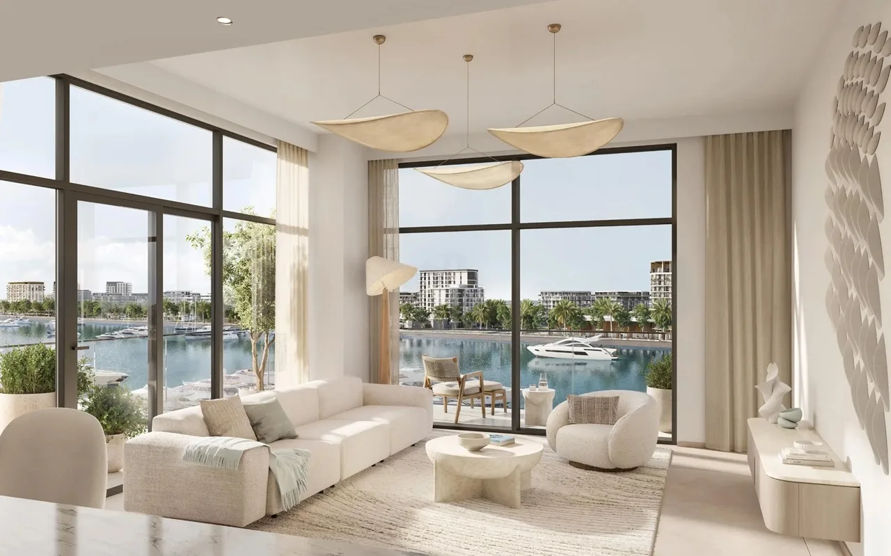 Porto View at Rashid Yachts & Marina by Emaar living room interior with large windows marina view soft furnishings and natural light in Dubai - Presented by Tohid Fetrat