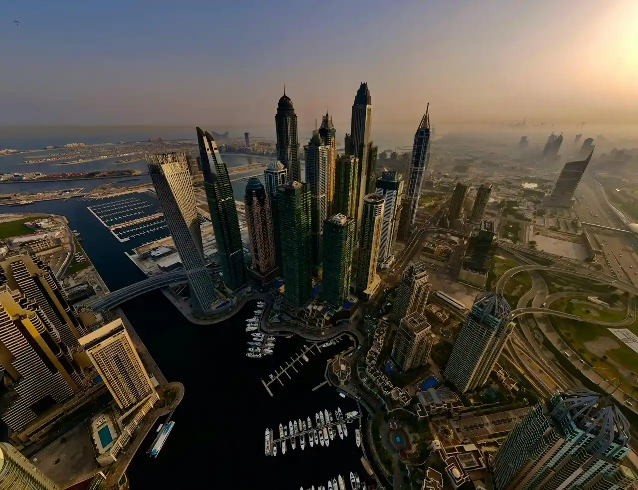 Property insurance after handover in Dubai types of insurance needed showcasing Dubai Marina skyline and waterfront towers Presented by Tohid Fetrat