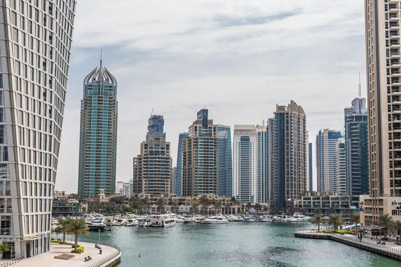 Property insurance claim rejection reasons in Dubai with Marina waterfront skyline and residential towers highlighting risks and denied claims scenarios Presented by Tohid Fetrat