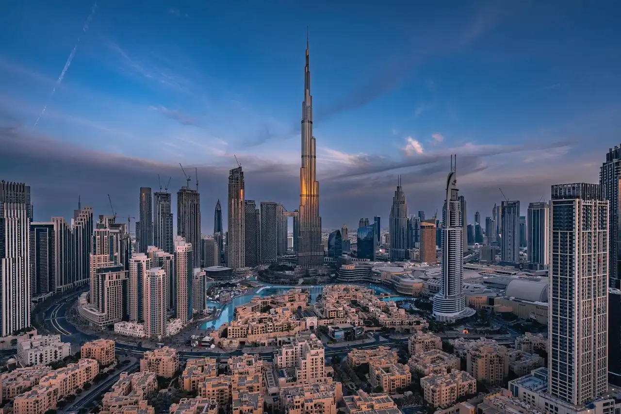 Property insurance cost in Dubai how to reduce cost strategies with skyline view of Downtown Dubai and Burj Khalifa Presented by Tohid Fetrat