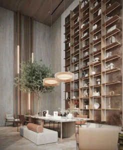 luxury library lounge with marble table pendant lights and double height shelving at Sunset Bay Grand by Imtiaz Dubai Islands Presented by Tohid Fetrat